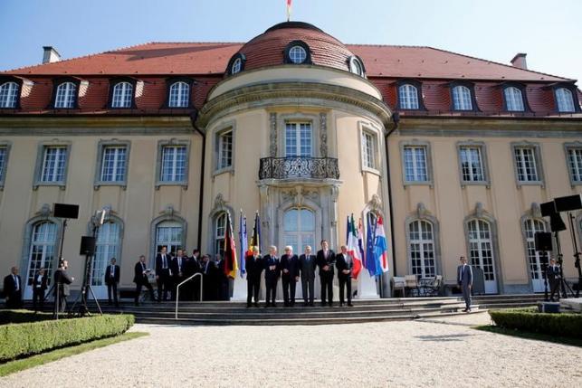 Ministers pose for a group picture before a foreign minister meeting of the EU founding members in Berlin