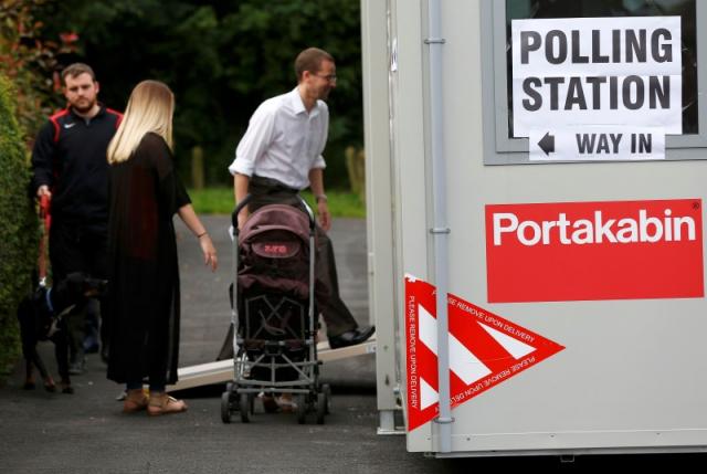 People arrive to vote at a polling station for the Referendum on the European Union in Heald Green, Stockpor