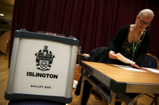 An electoral worker prepares up a polling station for the Referendum on the European Union in north London