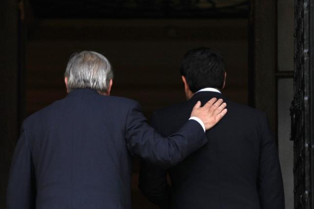 Greek Prime Minister Tsipras welcomes European Commission President Juncker at the Maximos Mansion in Athens