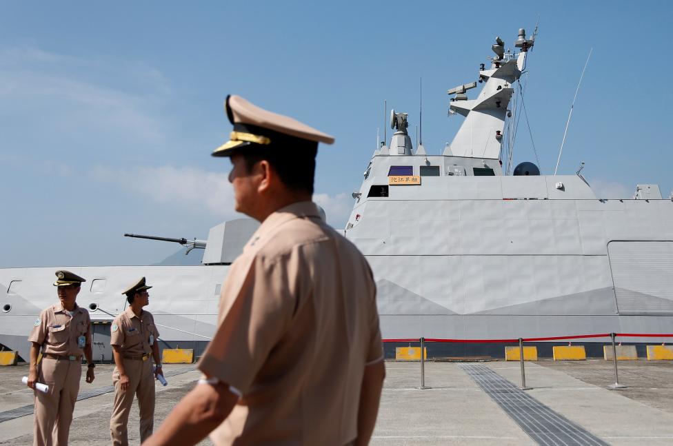 Taiwanese navy personnel are seen in front of the nation's first domestically built Tuo Jiang twin-hull corvette, at Suao Naval Base in Yilan, Taiwan