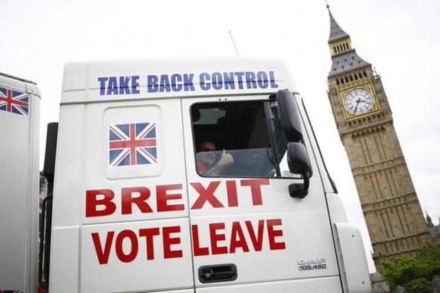 A truck is driven by Vote Leave supporters through Parliament Square in London