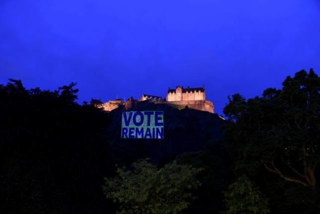 Edinburgh Castle rock is illuminated with a sign to "Vote Remain" in a show of support for the campaign to remain in Europe ahead of Thursday's EU Referendum in Scotland