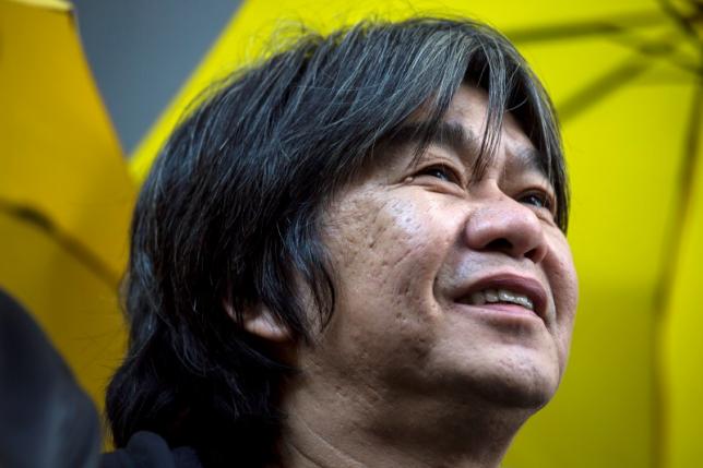 League of Social Democrats lawmaker "Long Hair" Leung Kwok-hung arrives at police headquarters to assist investigations in relation to the Occupy movement in Hong Kong