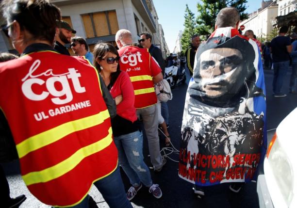 French CGT labour union employees march during a demonstration in Marseille as part of nationwide protests against plans to reform French labour laws