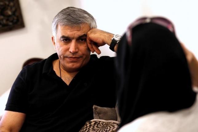 Human rights activists, Zainab al-Khawaja and Nabeel Rajab (L) talk during their meeting with activists after al-Khawaja's release from prison, Manama, Bahrain,