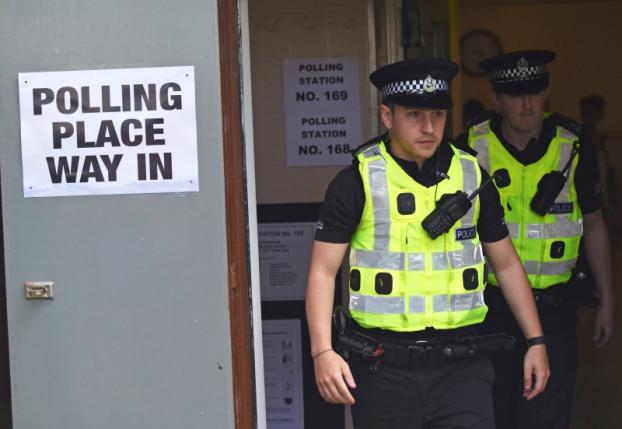 Police leave after to casting their votes in the EU referendum, at Broomhouse Community Hall in Glasgow