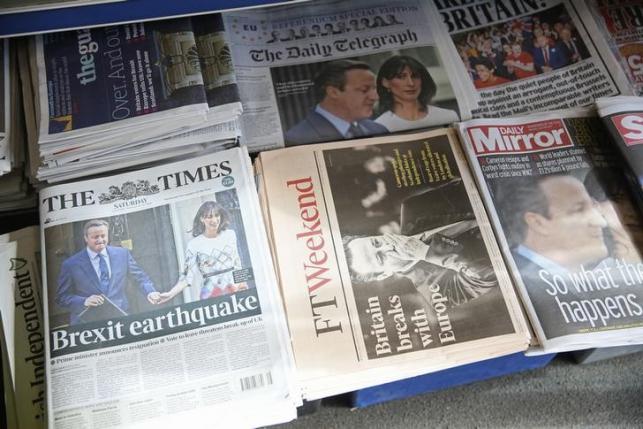 Newspapers are displayed for sale the day after Britain voted to leave the EU, at a newsagents in central London