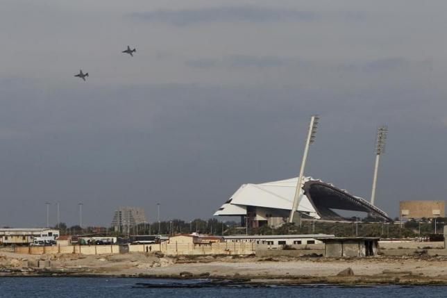 Russian warplanes fly in the sky over the Mediterranean coastal city of Latakia